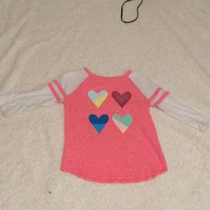 Pink shirt with hearts on it